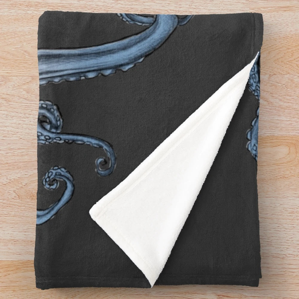 Plush blanket featuring a whimsical tentacles and sea creature design