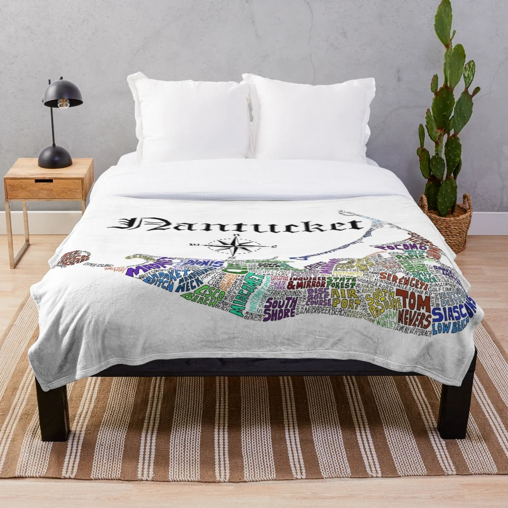Nantucket plush blanket featuring a map of Massachusetts with town names
