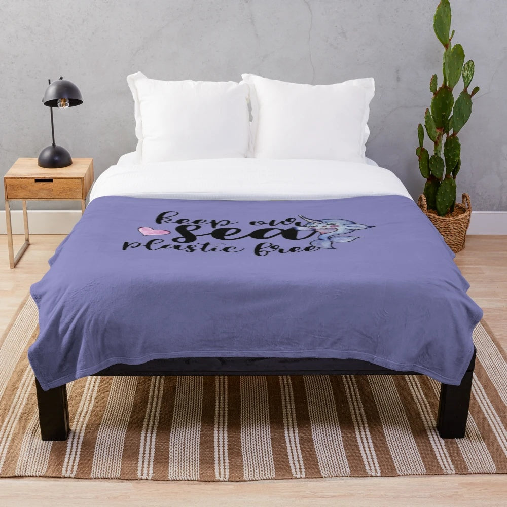 Narwhal plush blanket with a blue and white design