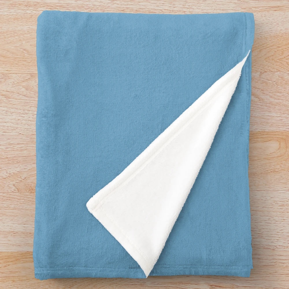 Narwhal plush blanket with a funny "feeling stabby" design