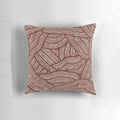 A decorative pillow with a creek bed design, inspired by Australian aboriginal art.