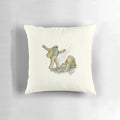 A soft, plush pillow featuring an illustration of two whimsical frogs and toads in a natural setting.