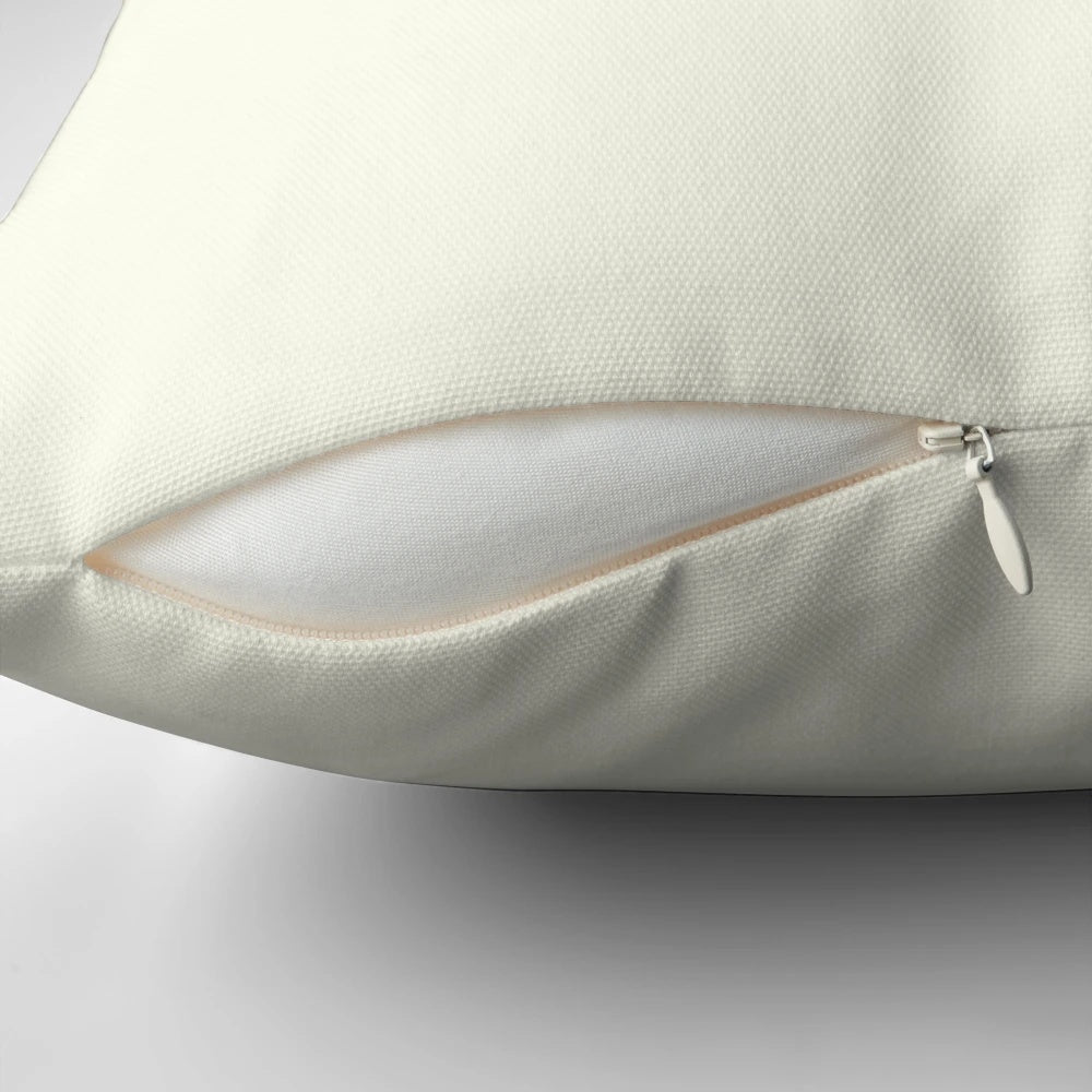 A soft, plush pillow featuring an illustration of two whimsical frogs and toads in a natural setting.