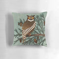 A beautifully crafted pillow featuring a hand-painted great horned owl and pine tree design