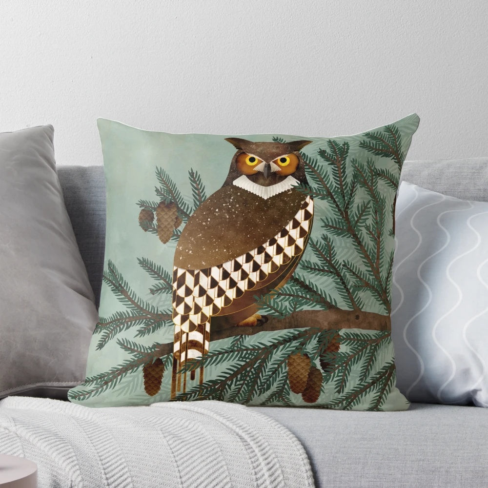 A beautifully crafted pillow featuring a hand-painted great horned owl and pine tree design