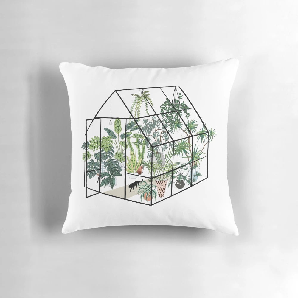 Cozy green and floral pillow with a greenhouse design, featuring lush plants and greenery.