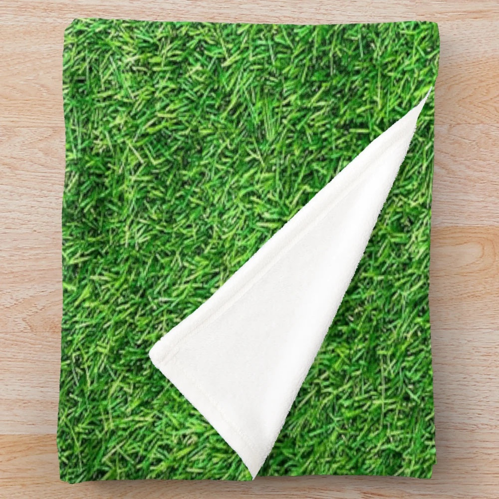 Soft and cozy plush blanket with a nature-inspired grass-like texture