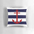 Nautical-inspired pillow with a red anchor design on navy blue and white striped background