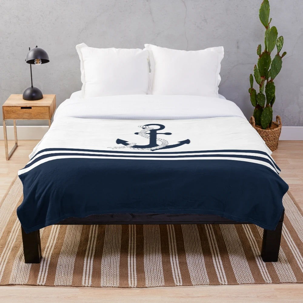 Nautical blue anchor plush blanket with blue and white striped pattern
