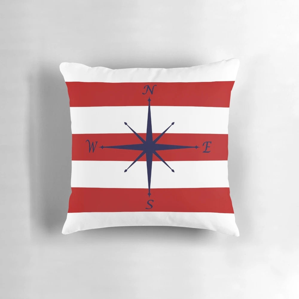 Nautical compass design on a navy blue, red and white striped decorative pillow