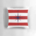 Nautical compass design on a navy blue, red and white striped decorative pillow