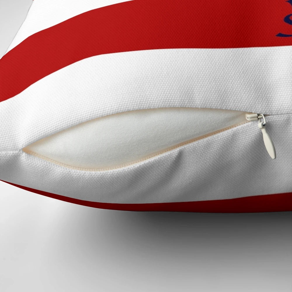 Nautical compass design on a navy blue, red and white striped decorative pillow