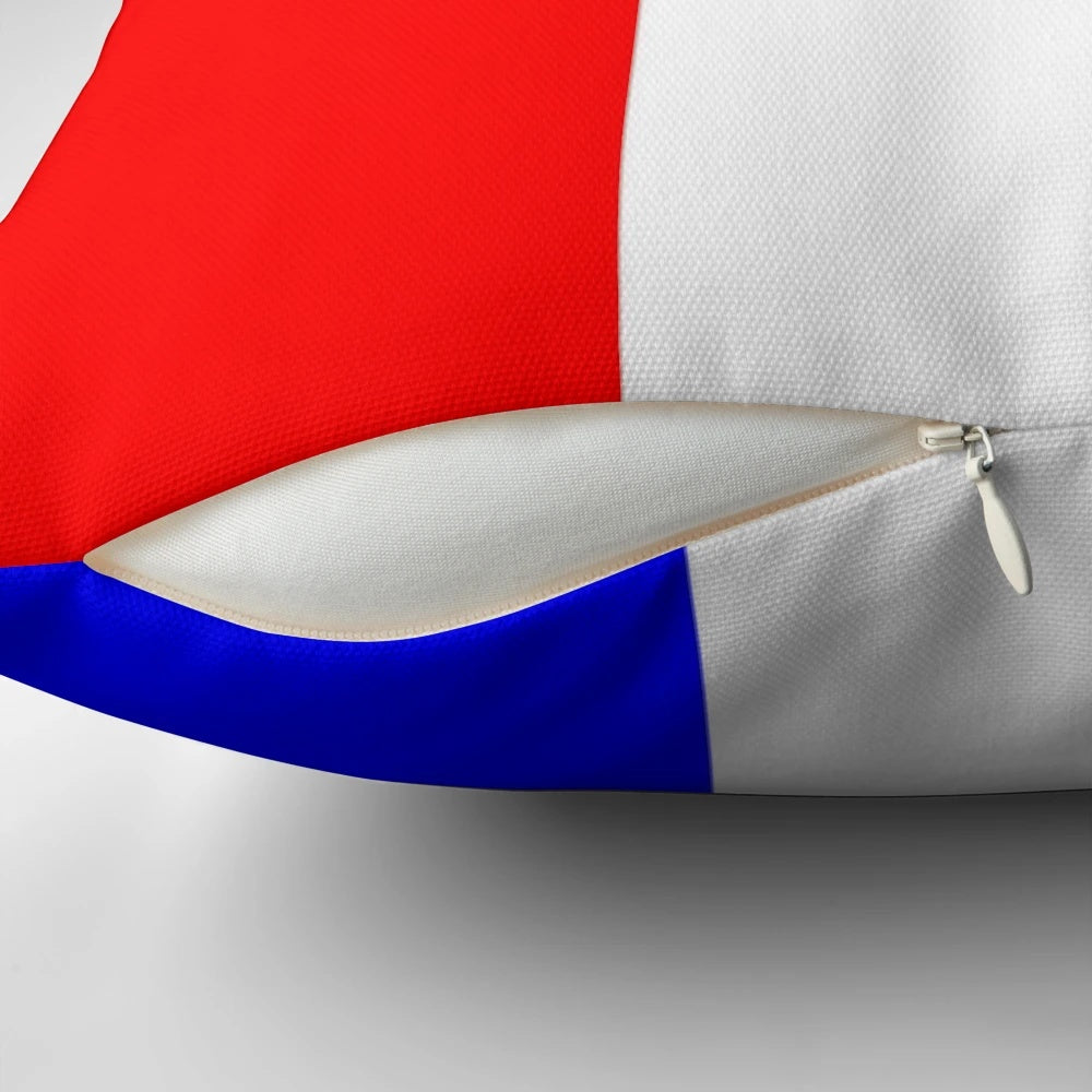 An international maritime signal flags alphabet pillow featuring the letter T, perfect for coastal home decor.