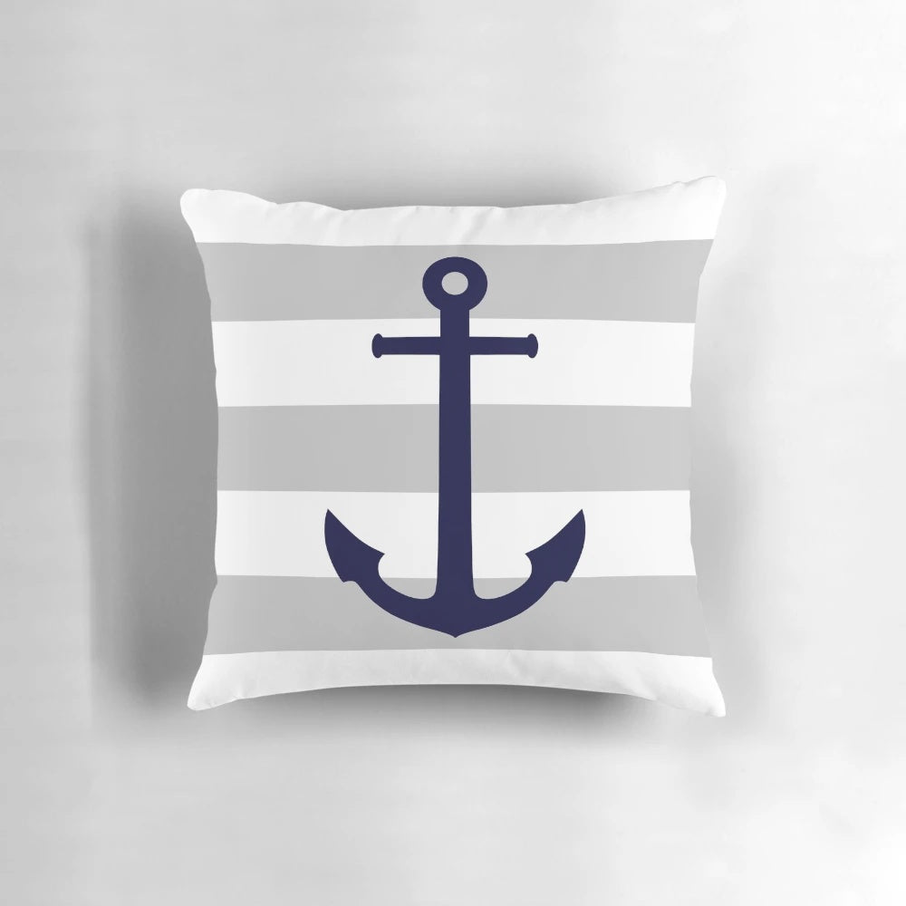 Navy blue and gray striped pillow with an anchor design, perfect for coastal decor