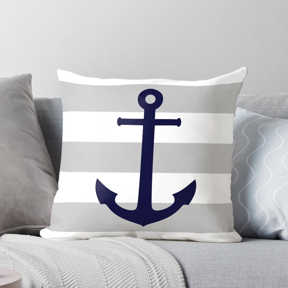 Navy blue and gray striped pillow with an anchor design, perfect for coastal decor