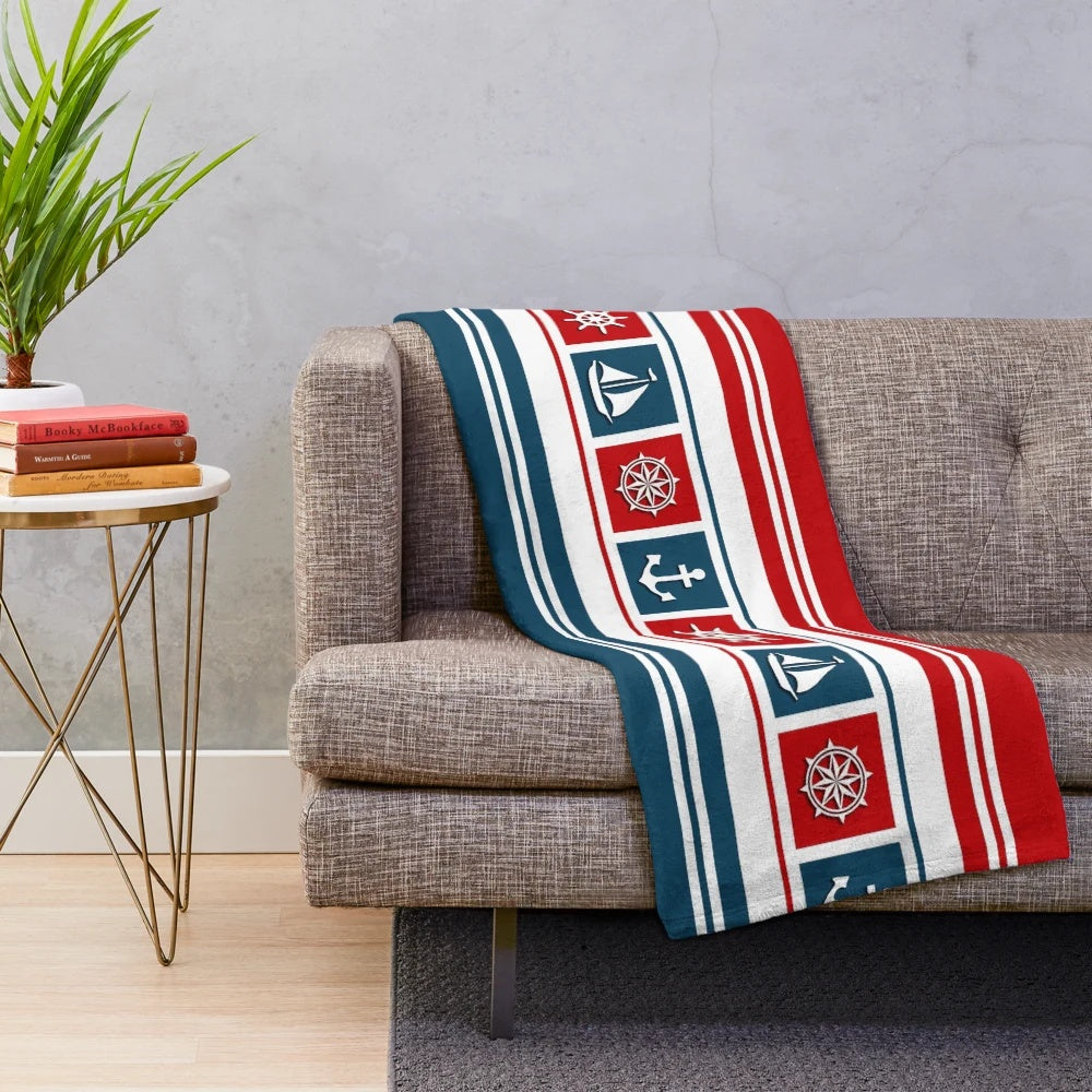 Nautical-themed plush blanket with nautical symbols and striped pattern