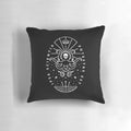 A white pillow with a skull and octopus design, representing the power of knowledge and ancient maritime mythology.