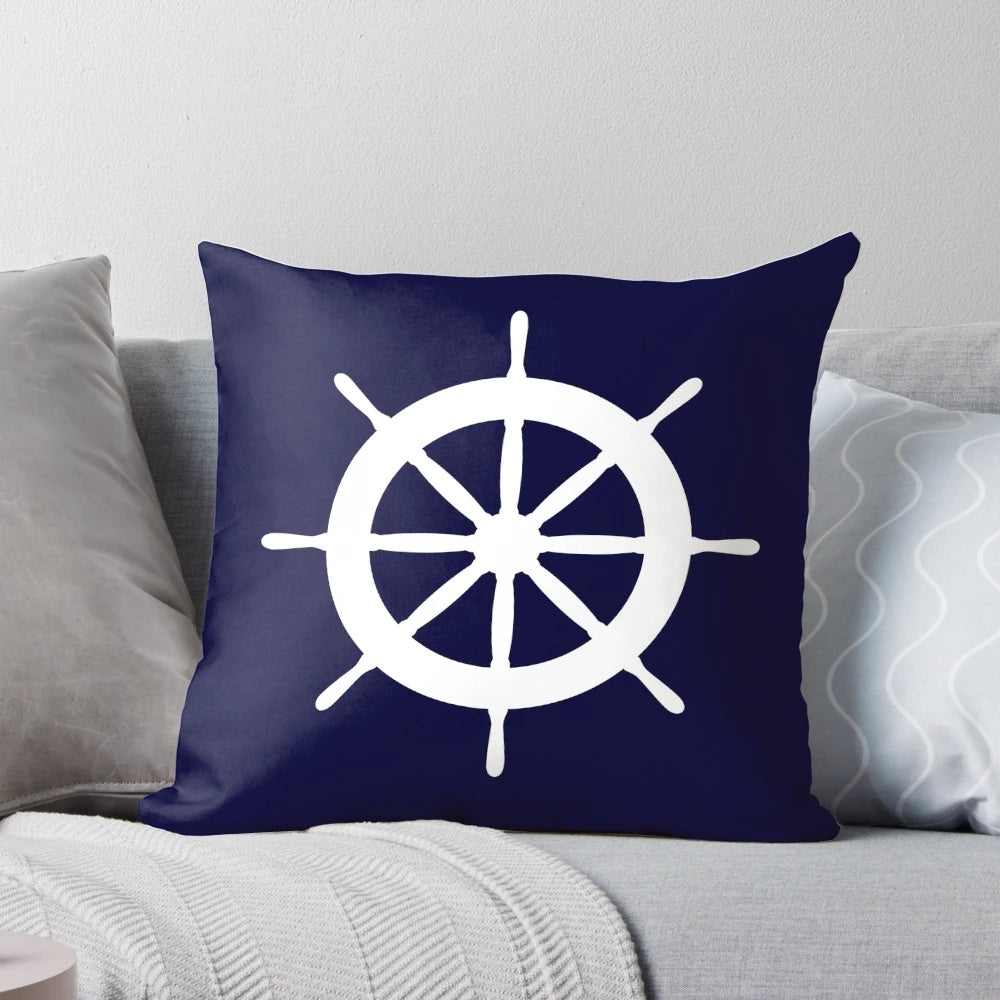White ship steering wheel against a navy blue background on a plush, high-quality pillow.