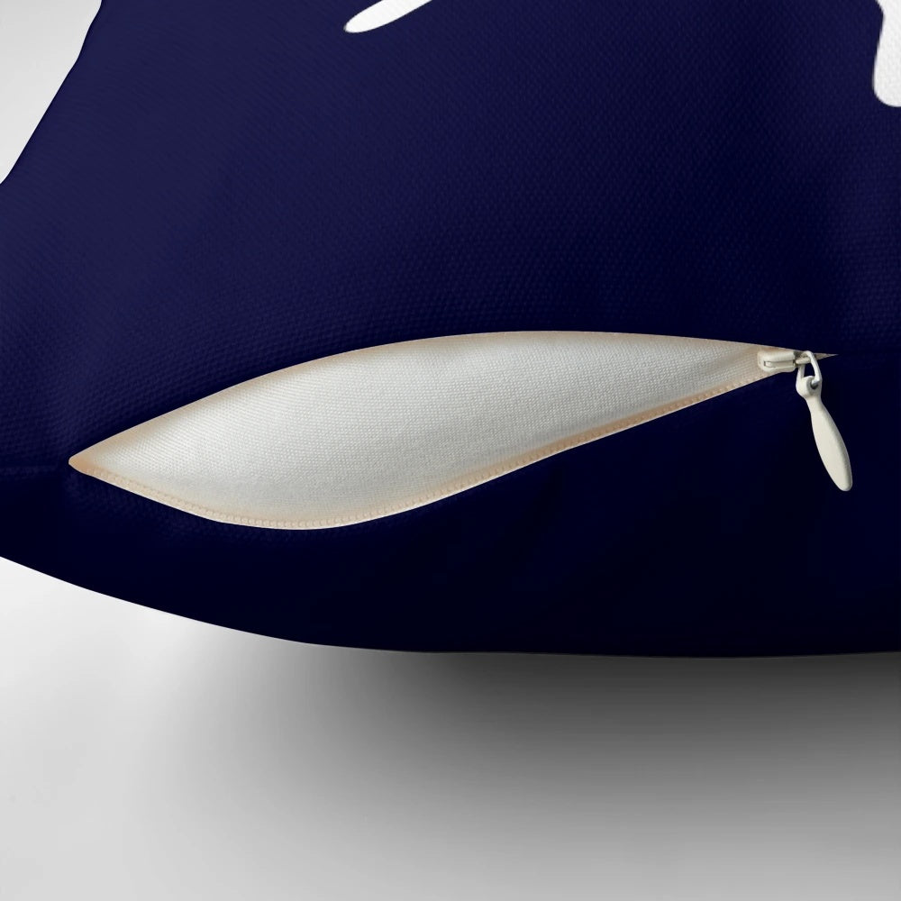White ship steering wheel against a navy blue background on a plush, high-quality pillow.