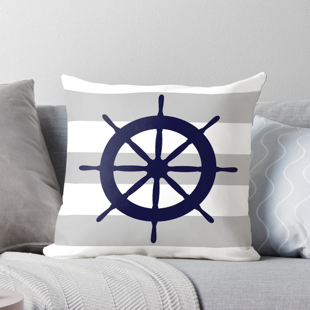 Navy blue and gray striped nautical-themed accent pillow with a steering wheel design