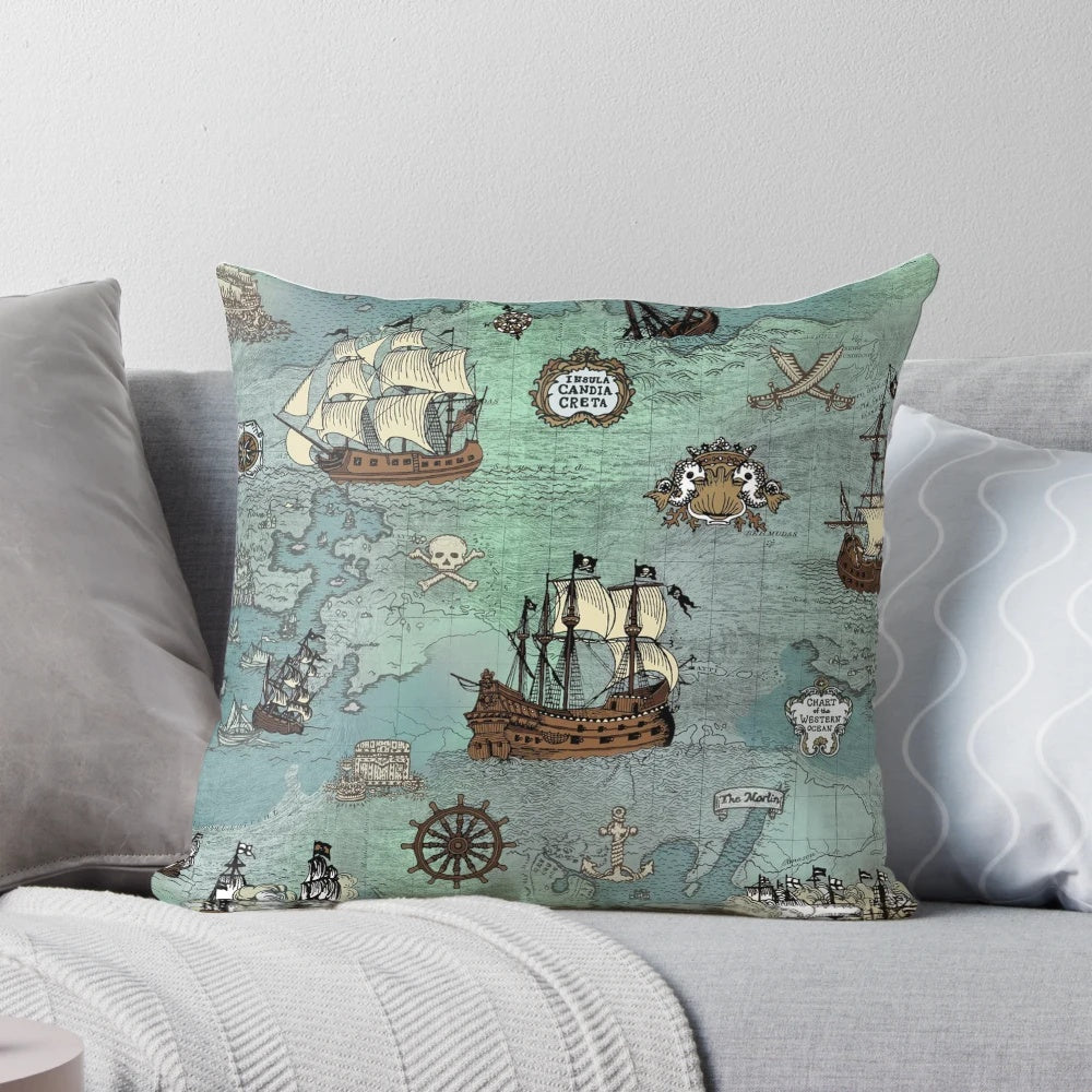 Decorative throw pillow featuring a pirate map print in ocean blue and sea glass green colors.