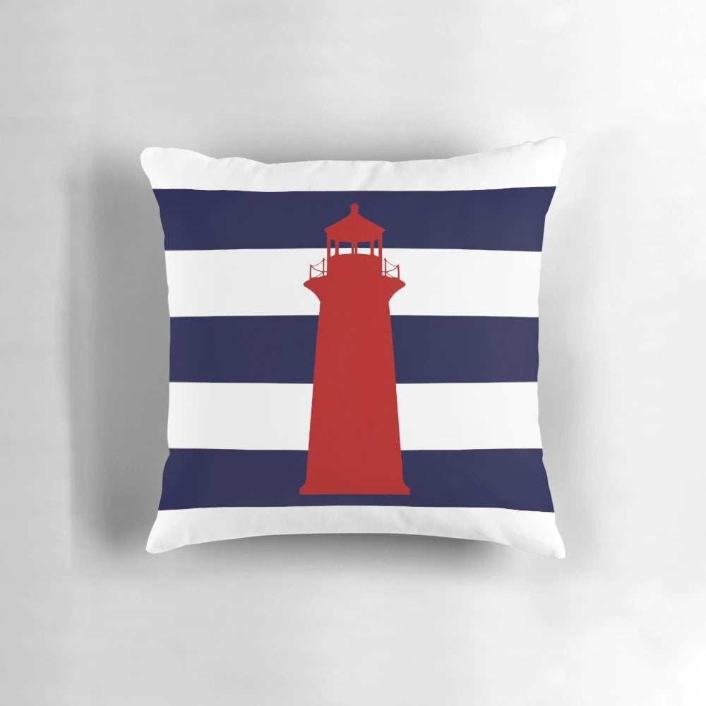 Nautical red lighthouse design on a navy blue and white striped pillow