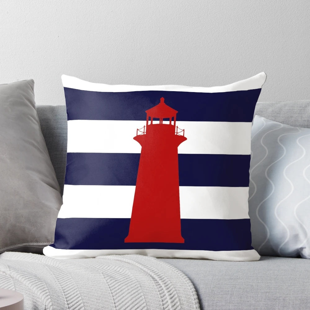 Nautical red lighthouse design on a navy blue and white striped pillow