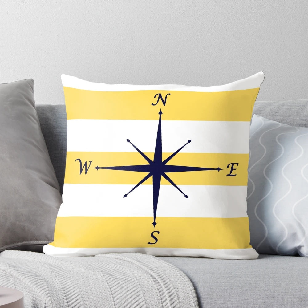 Navy blue and mustard yellow striped pillow with a compass design, perfect for coastal or nautical-themed home decor.
