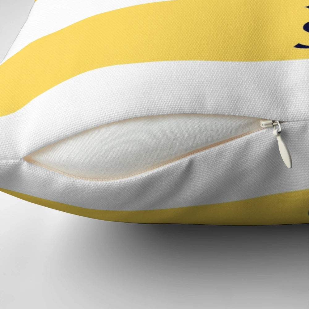 Navy blue and mustard yellow striped pillow with a compass design, perfect for coastal or nautical-themed home decor.