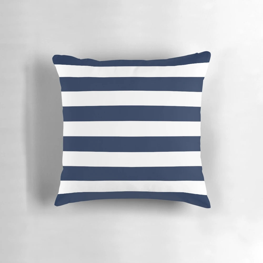 Navy blue and white minimalist striped decorative pillow for coastal, nautical, or beachy home decor.