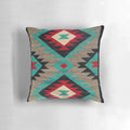A decorative throw pillow featuring a vibrant Navajo-inspired pattern in shades of turquoise, red, grey, and black.