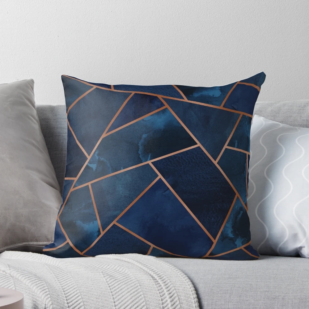 Navy and copper geometric patterned decorative throw pillow