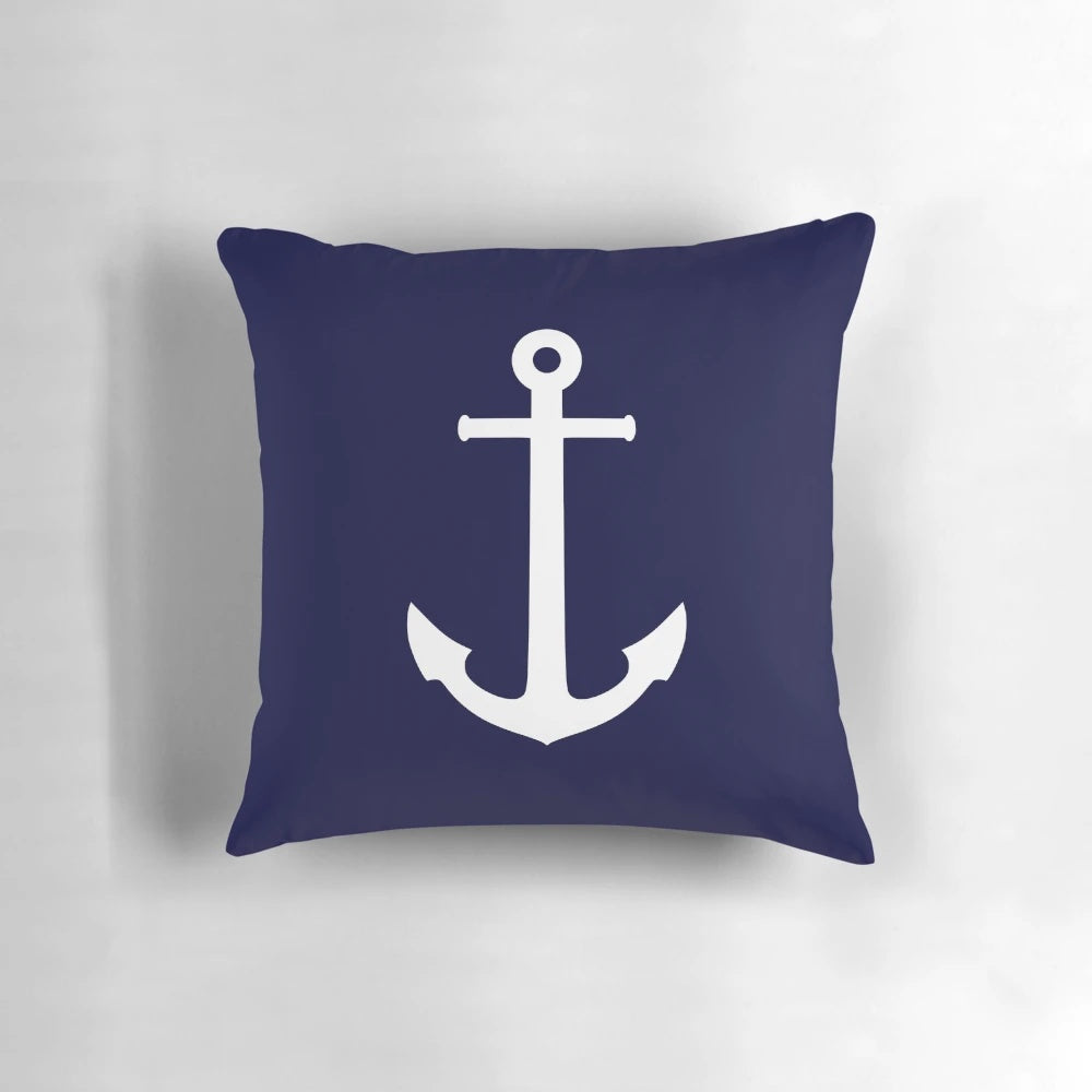 Navy blue throw pillow with white anchor design for coastal home decor