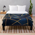 Navy blue and gold geometric pattern plush blanket