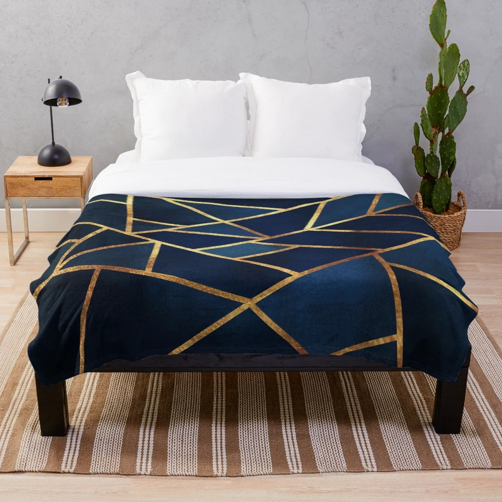 Navy blue and gold geometric pattern plush blanket