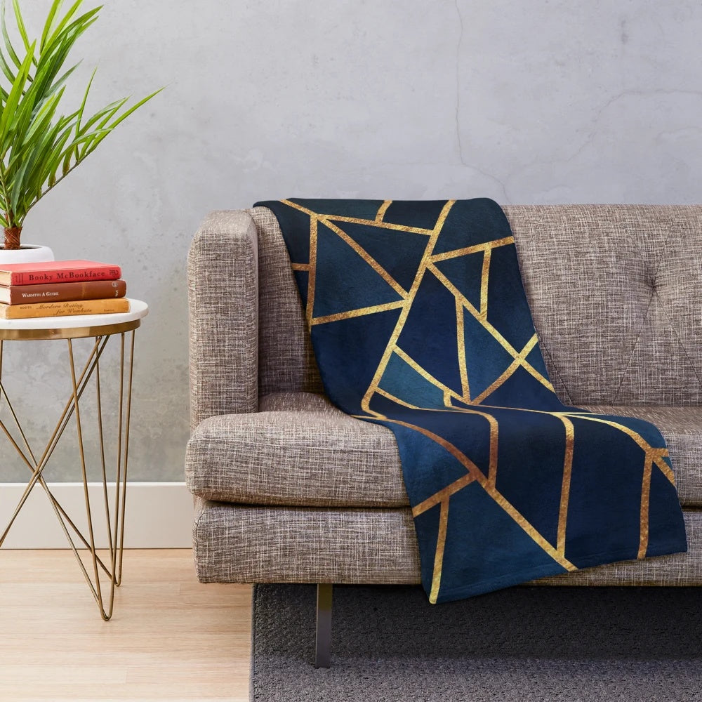 Navy blue and gold geometric pattern plush blanket