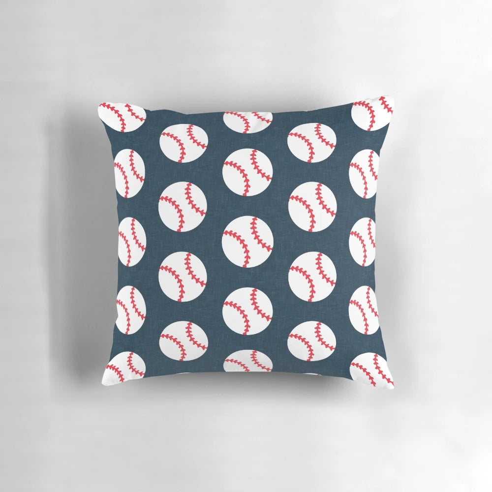 Navy blue baseball-themed pillow with baseball graphics on a dark blue background