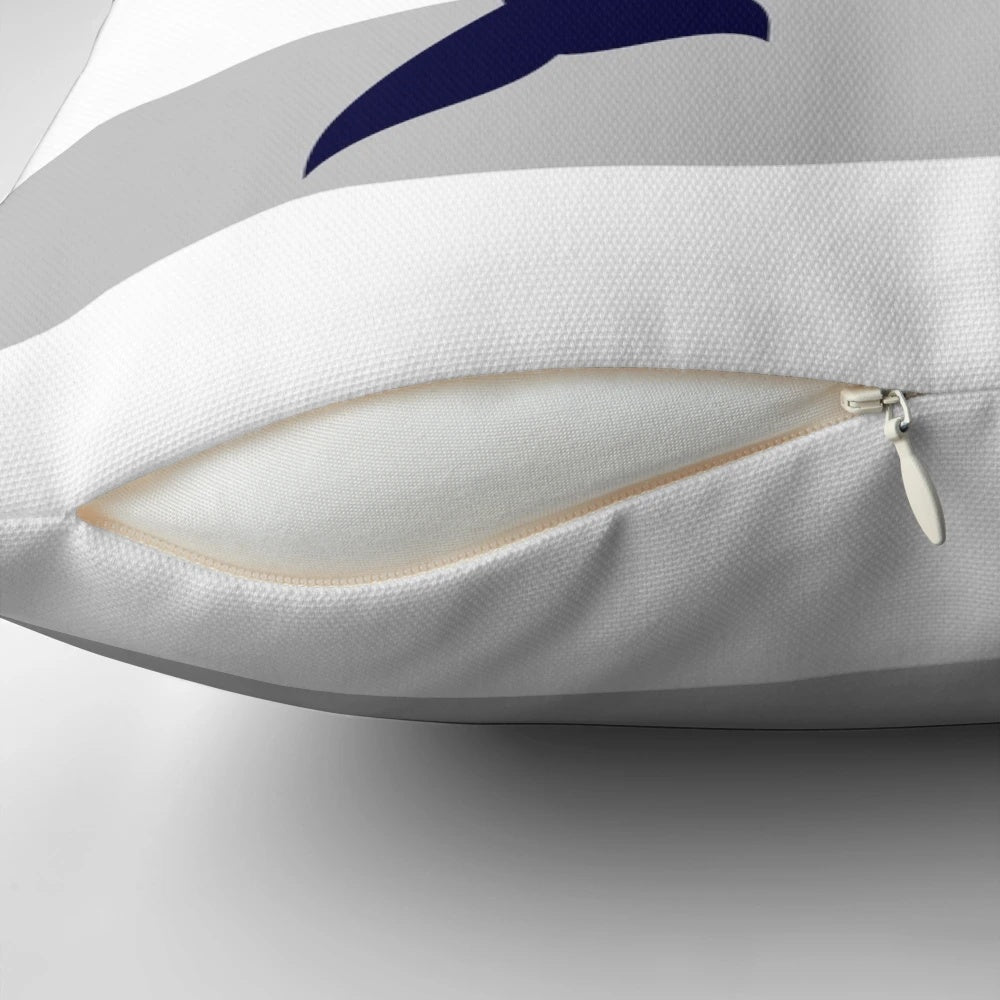 Navy blue dolphin jumping on a silver gray striped coastal throw pillow