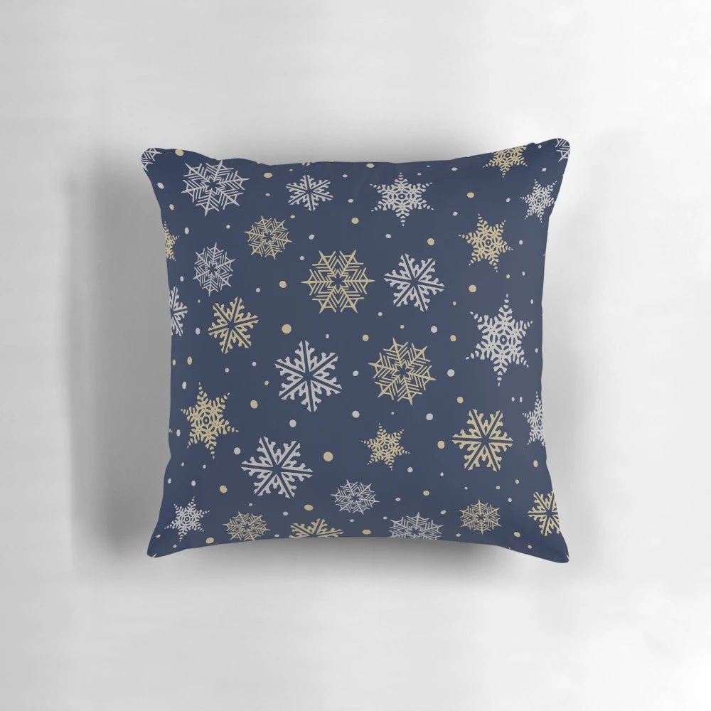 Navy blue pillow with elegant gold and silver snowflake design