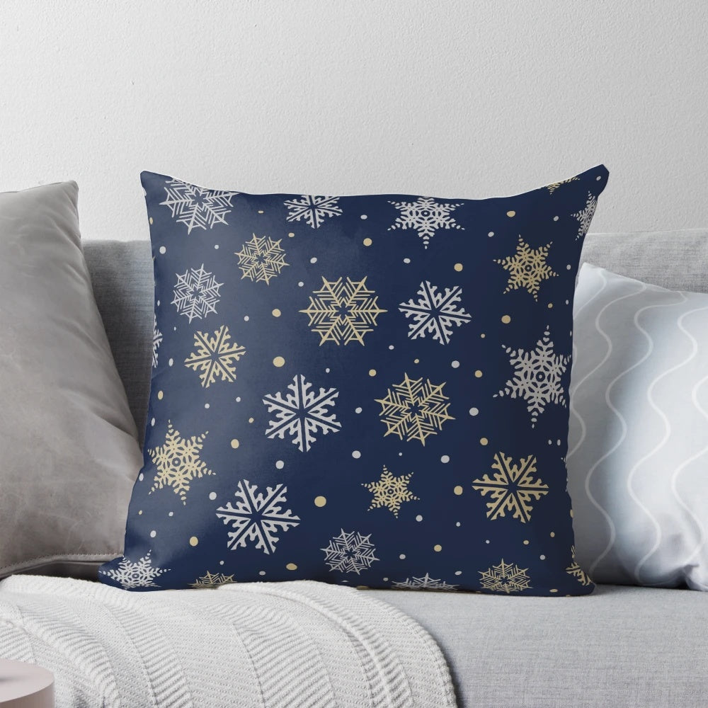 Navy blue pillow with elegant gold and silver snowflake design
