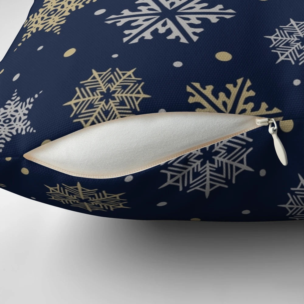 Navy blue pillow with elegant gold and silver snowflake design