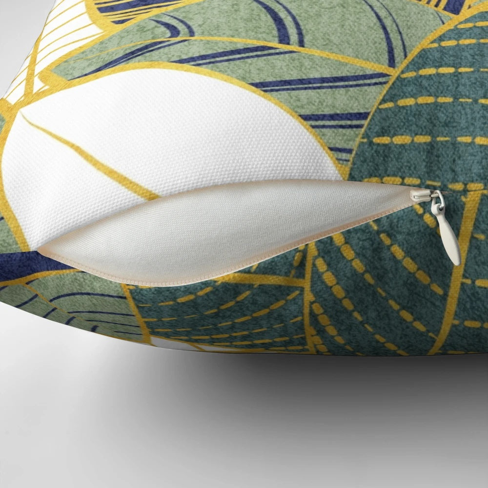 Decorative throw pillow with navy blue, pine, and sage green leaves with golden lines