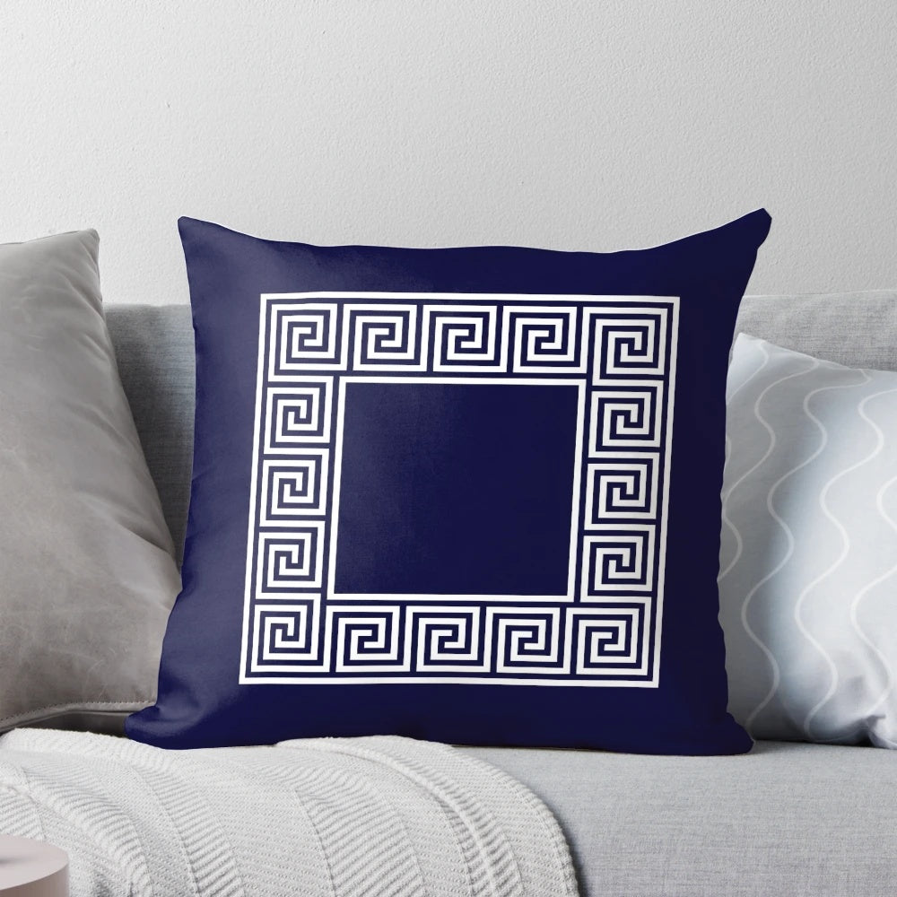 Navy blue square throw pillow with a classic Greek key meander border design