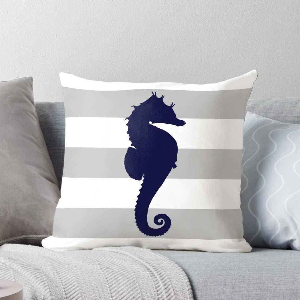 Navy blue and silver gray striped pillow with a seahorse design