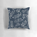 Navy blue and white hand-painted throw pillow with a botanical leaf pattern