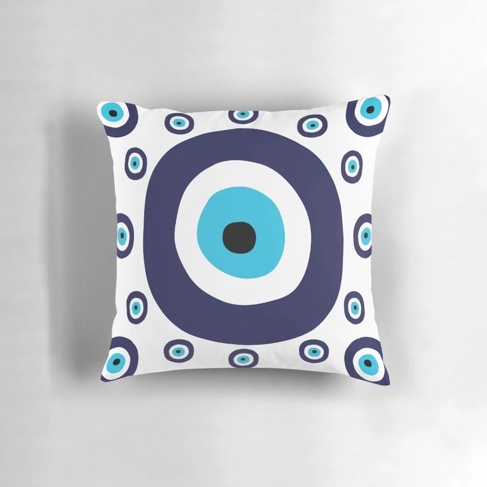 Navy blue and aqua pillow with a nazar evil eye lucky charm pattern