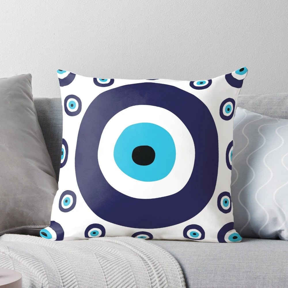 Navy blue and aqua pillow with a nazar evil eye lucky charm pattern
