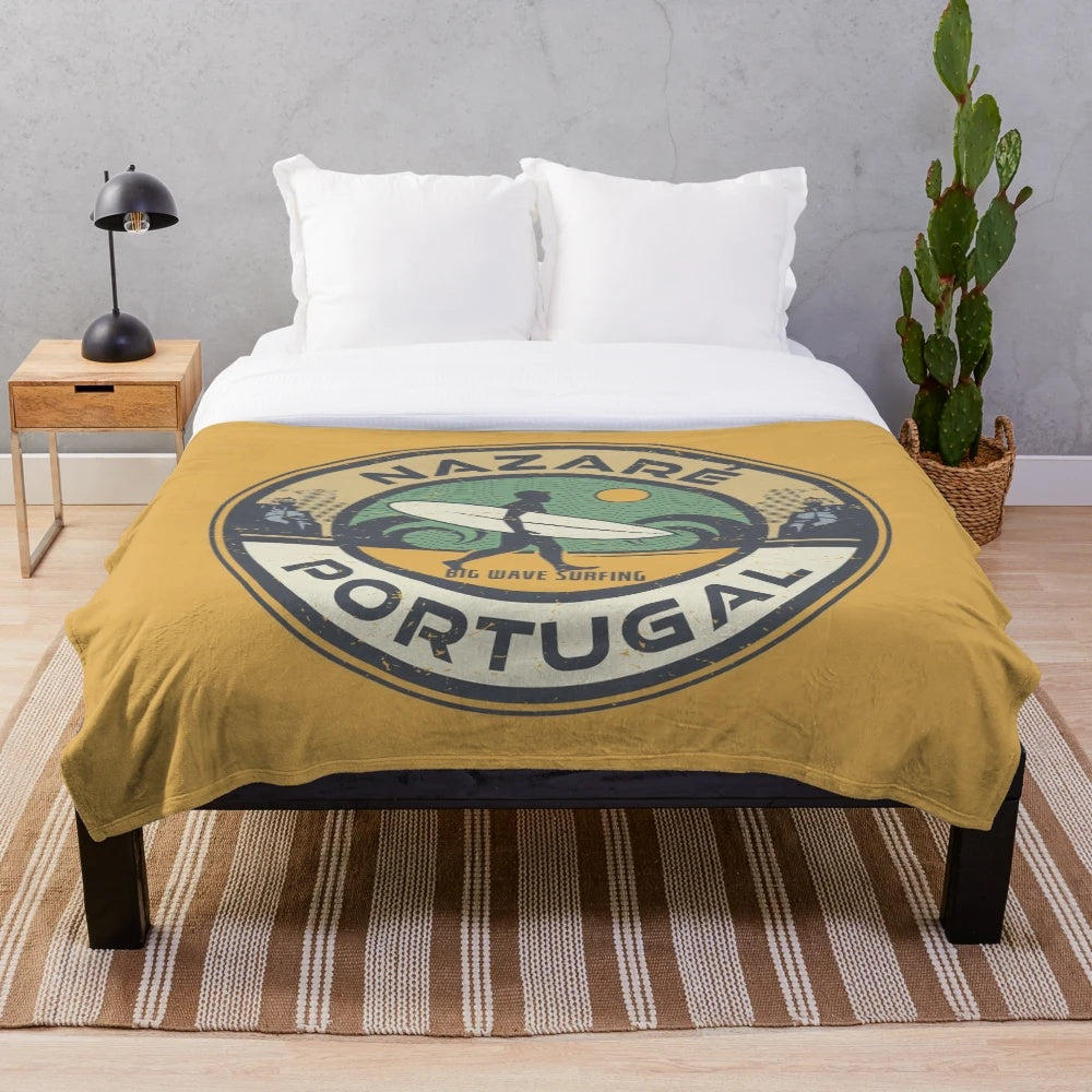 Nazare, Portugal inspired plush blanket with surfing, beach, and nautical design elements