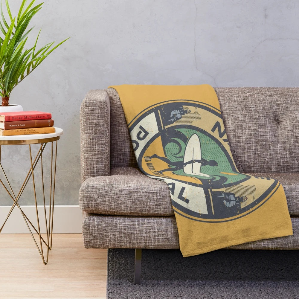 Nazare, Portugal inspired plush blanket with surfing, beach, and nautical design elements