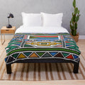 Ndebele-inspired plush blanket with vibrant tribal design
